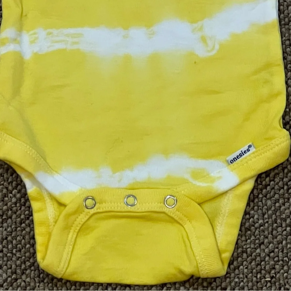 12 months one piece with matching headband tie dye polka dots. Yellow and white